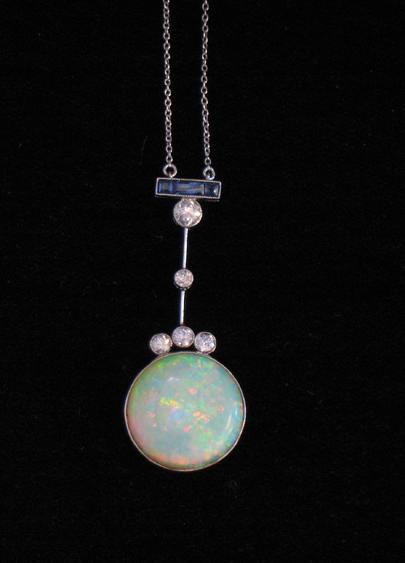 Appraisal: AN ART DECO PENDANT the large round cabochon opal to