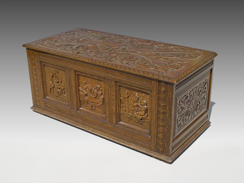 Appraisal: CARVED OAK BLANKET CHEST German tavern scenes in recessed panels