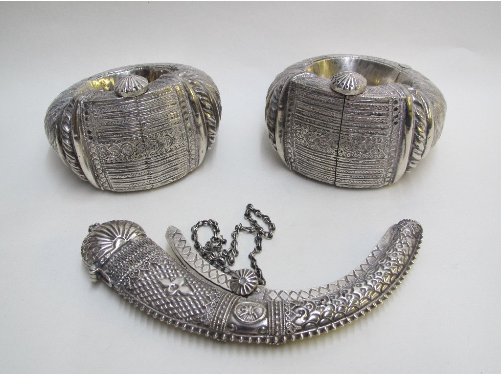 Appraisal: A Persian silver powder flask with hinged cover and sprung