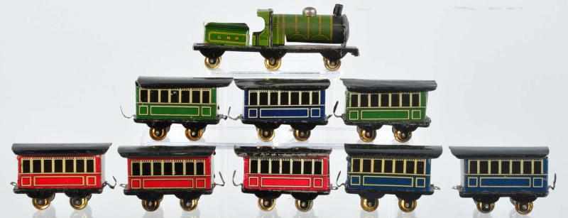 Appraisal: Tin Litho Train Set Penny Toy German Includes combination engine