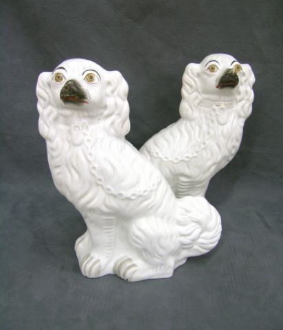 Appraisal: Pair of white Staffordshire dogs with gray paws gold severely