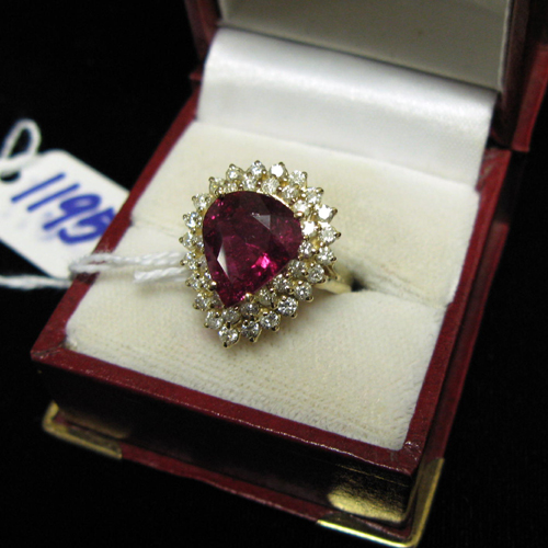 Appraisal: A RUBY DIAMOND AND FOURTEEN KARAT GOLD DINNER RING The