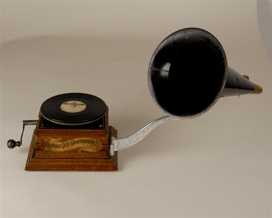 Appraisal: A Columbia Disc Graphophone with a single disc an oak