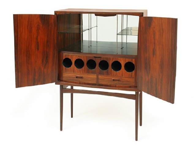 Appraisal: A SCANDINAVIAN ROSEWOOD COCKTAIL CABINET With dual doors opening to