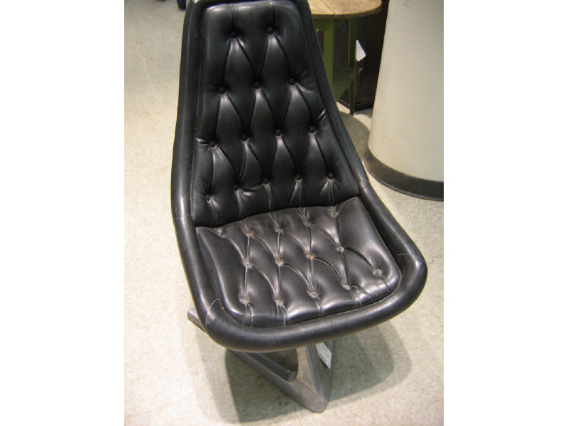 Appraisal: MANNER OF VLADAMIR KAGAN Pair of black vinyl upholstered swivel