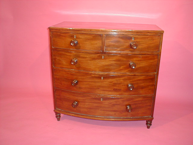 Appraisal: A Victorian flamed mahogany bow front chest of two short