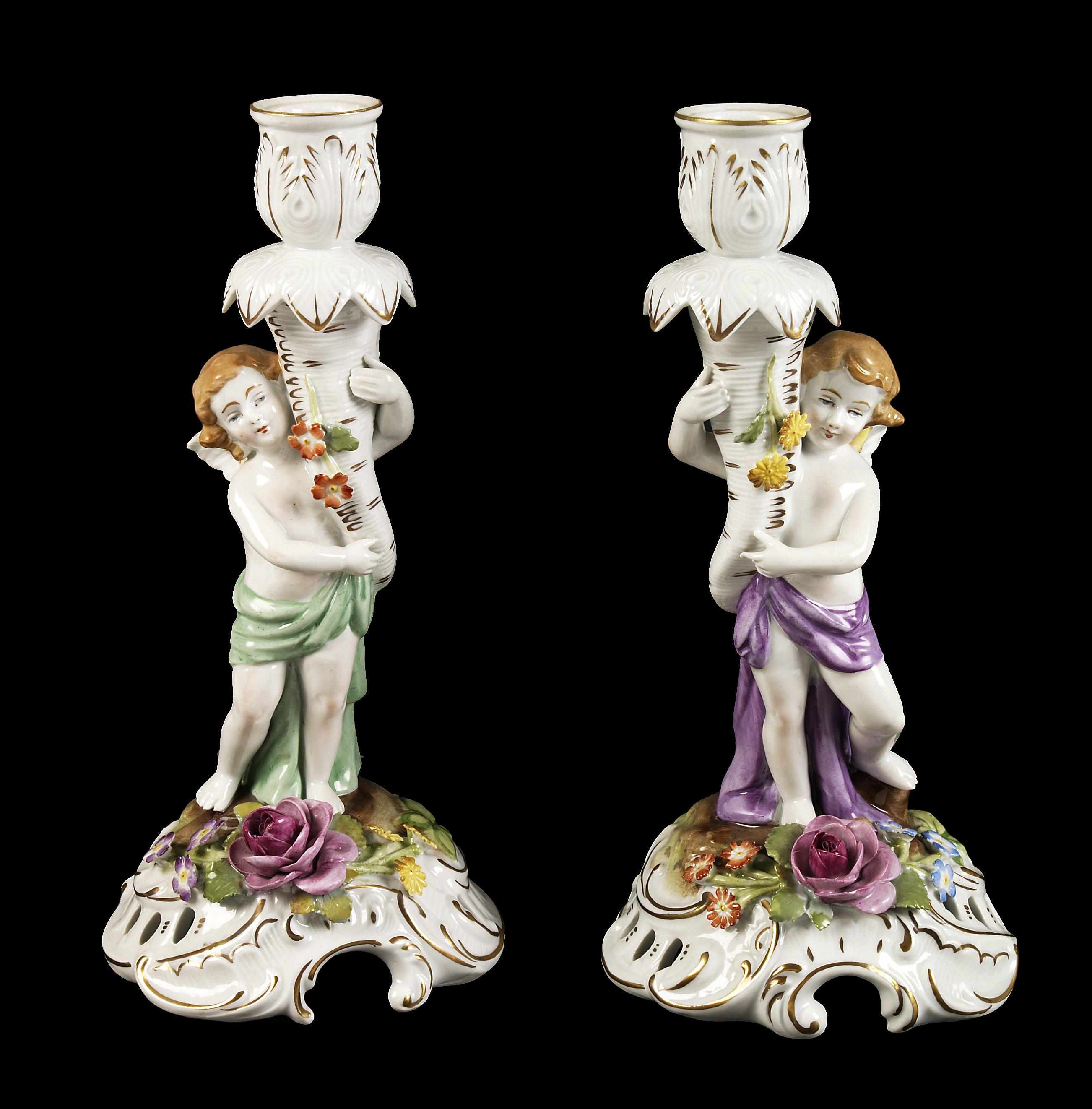 Appraisal: A pair of German Rococo style porcelain candlesticks height in