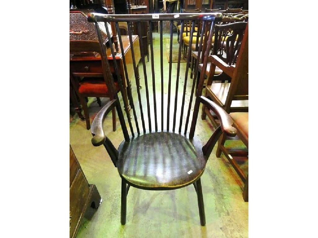 Appraisal: An Edwardian stained beech wood open elbow chair with raised