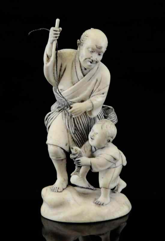 Appraisal: A Japanese ivory group of a fisherman and a boy