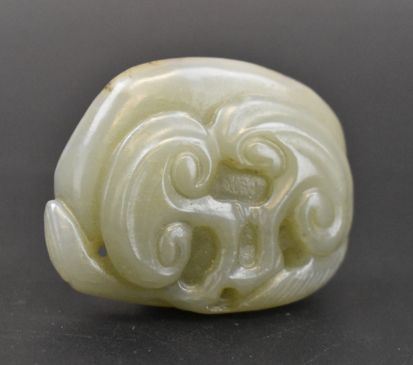 Appraisal: A Chinese Jade carved toggle with Lingzhi dating from the