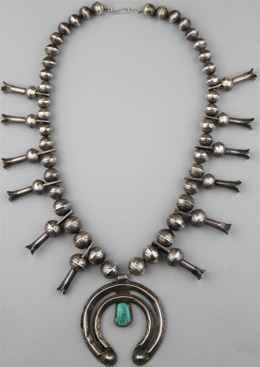 Appraisal: NAVAJO SILVER AND TURQUOISE SQUASH BLOSSOM NECKLACE large hollow beads