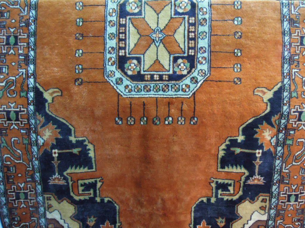 Appraisal: A Middle Eastern design carpet with a central geometric medallion