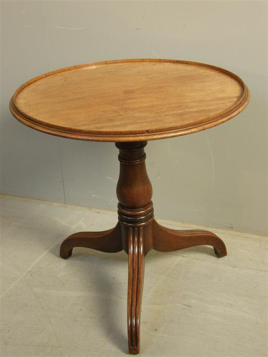 Appraisal: George III mahogany circular tripod table on turned column and