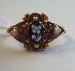 Appraisal: A Victorian carved agate cameo ruby and pearl set ring