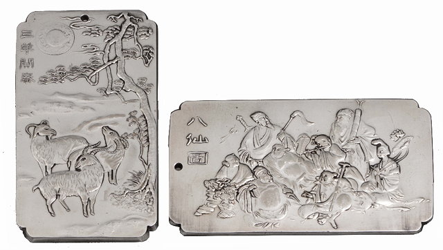 Appraisal: A PAIR OF CHINESE SILVER PENDANTS one depicting rams beneath