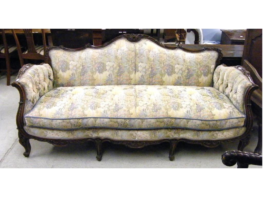 Appraisal: French style walnut three seater settee the shaped foliate carved