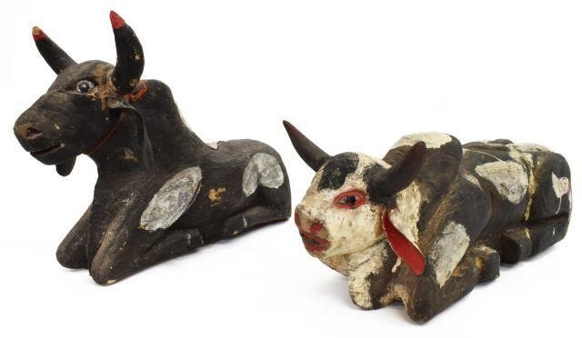 Appraisal: lot of Mexican carved wood recumbent cow sculptures each spotted