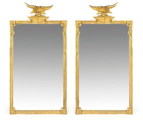 Appraisal: A pair of Federal style carved giltwood mirrors th century