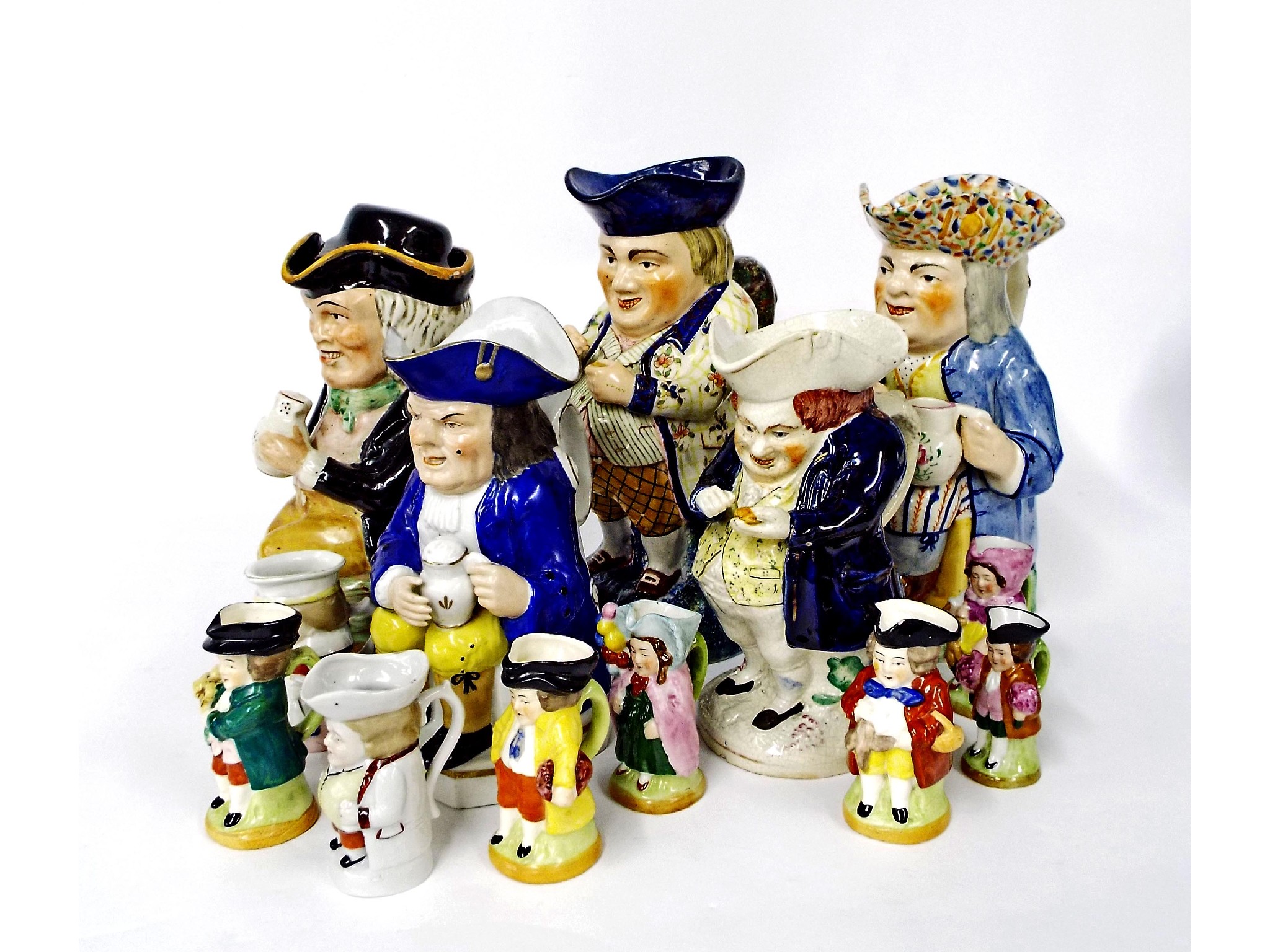 Appraisal: Collection of thirteen various ceramic Toby jugs to include four