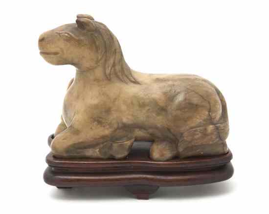 Appraisal: A Chinese Soapstone Model of a Horse of opaque pale