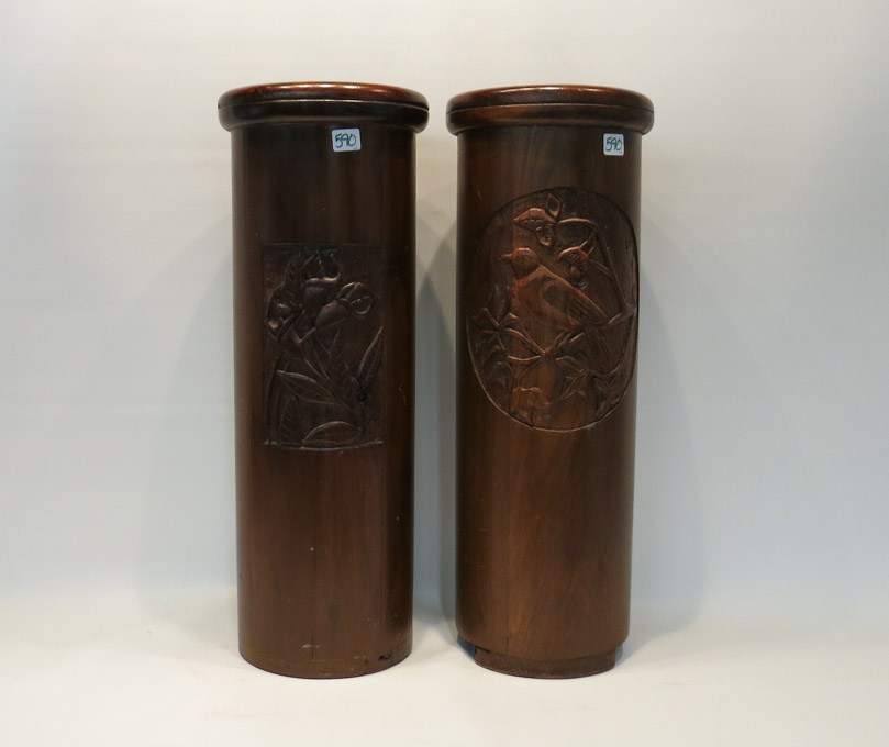 Appraisal: TWO CARVED WOOD UMBRELLA STANDS with bird and floral carved