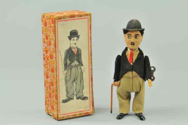 Appraisal: CHARLIE CHAPLIN WALKING FIGURE Germany boxed example tin body wears