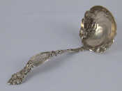 Appraisal: An American silver marked sterling Art Nouveau ladle Wt gm