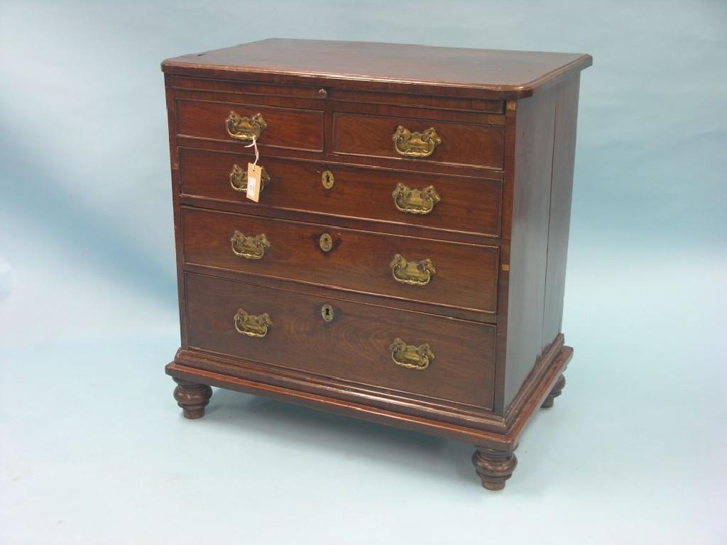 Appraisal: A George II red walnut bachelor's chest brushing slide above