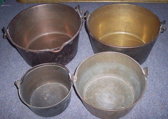 Appraisal: Two brass preserving pans with iron swing handles and two