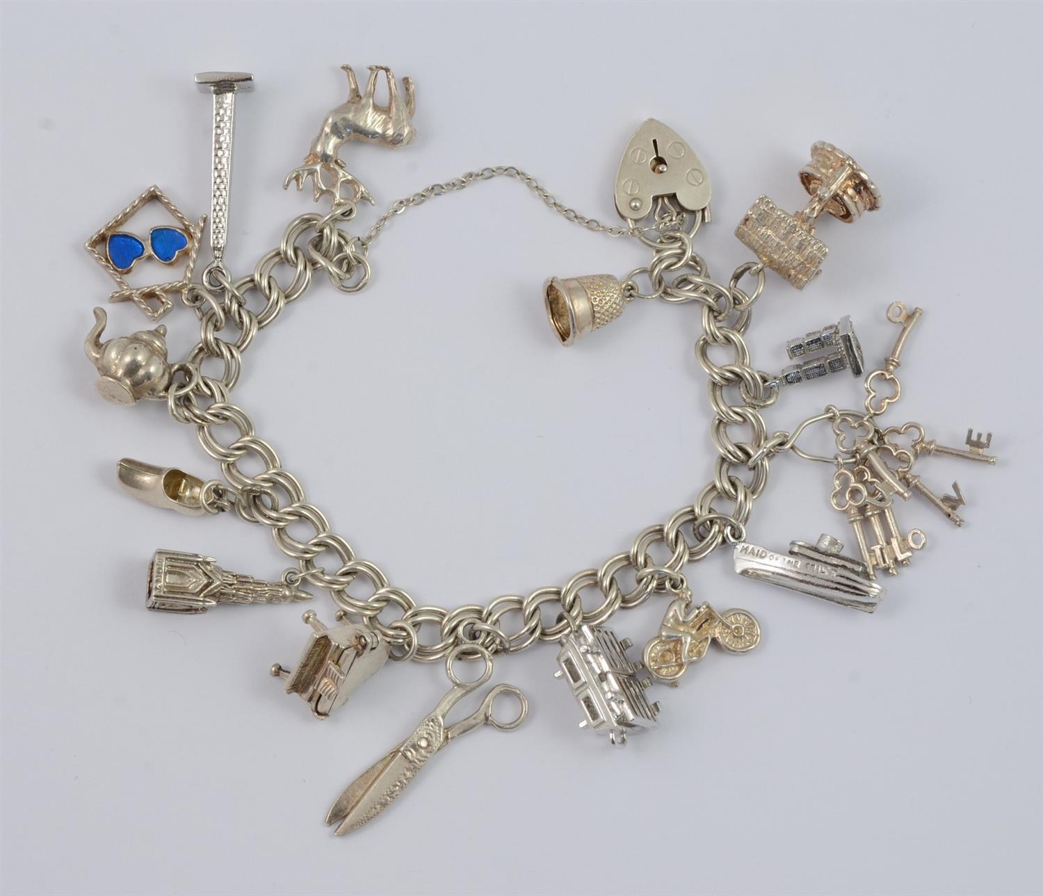 Appraisal: Sterling silver charm bracelet charms some unmarked padlock catch TO