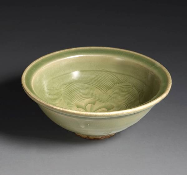 Appraisal: A Yaozhou celadon glazed stoneware bowl with carved decoration Jin