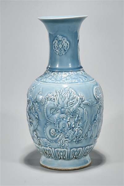 Appraisal: Chinese blue glazed porcelain vase depicting dragons chasing pearls in