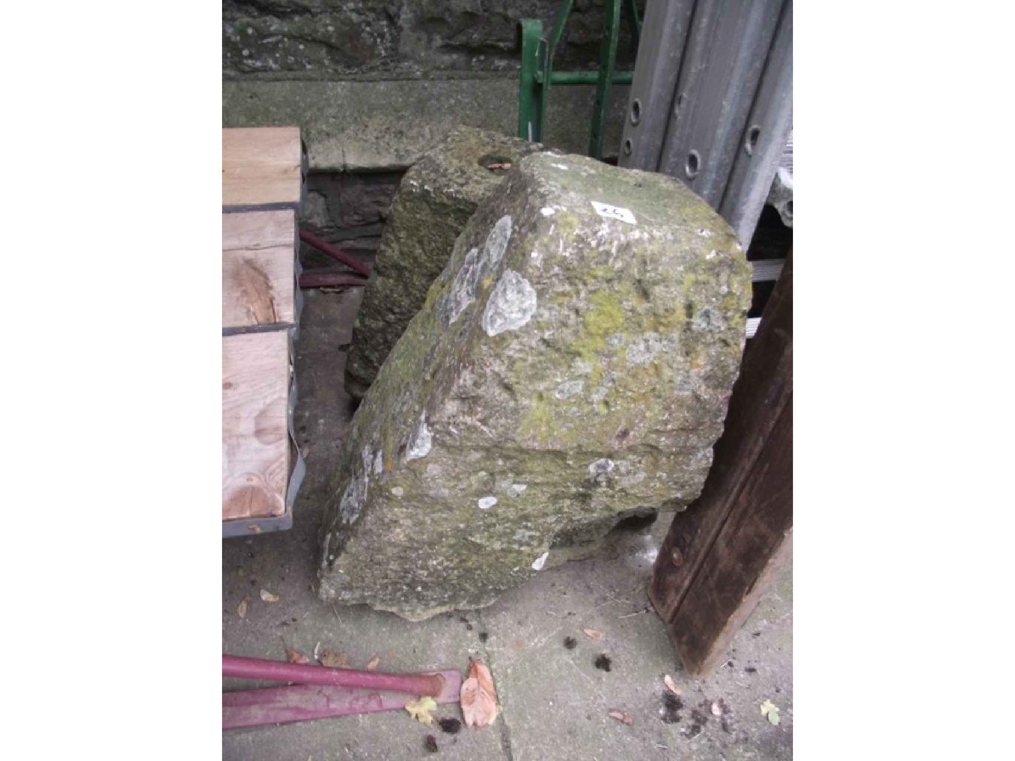 Appraisal: Two weathered natural stone staddle stone bases of varying height