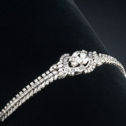 Appraisal: Diamond and pt bracelet centers a bypass cluster of pear-cut