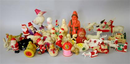 Appraisal: Collection of holiday celluloid toys Including Santas Santa driving a