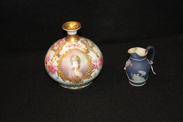 Appraisal: A ROYAL BONN PORCELAIN OVOID VASE with painted reserve panel