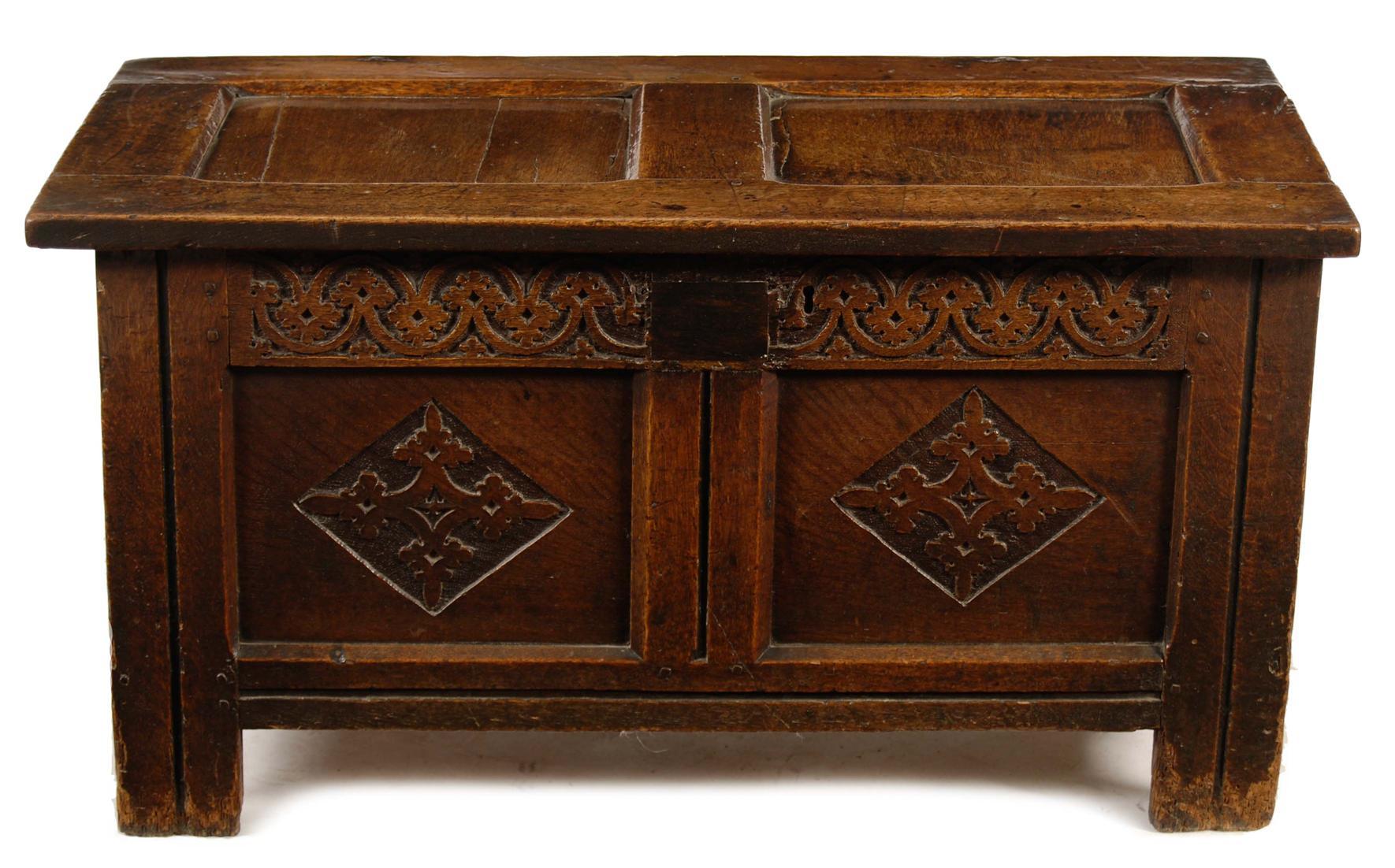 Appraisal: A small panelled oak coffer