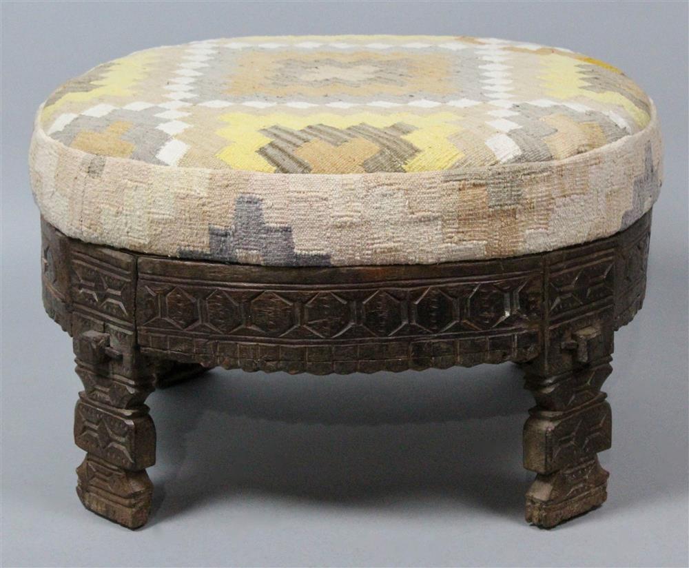 Appraisal: SOUTHWESTERN STYLE CARVED OTTOMAN round boxed cushion top upholstered in