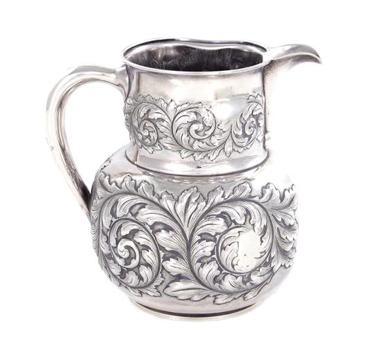 Appraisal: Gorham sterling beverage pitcher dated floral repousse design marked Gorham