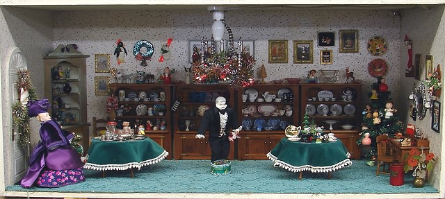 Appraisal: Diorama Christmas Gift Shop China dollhouse dolls several cupboards of