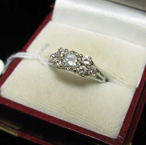 Appraisal: DIAMOND AND EIGHTEEN KARAT WHITE GOLD RING set with one