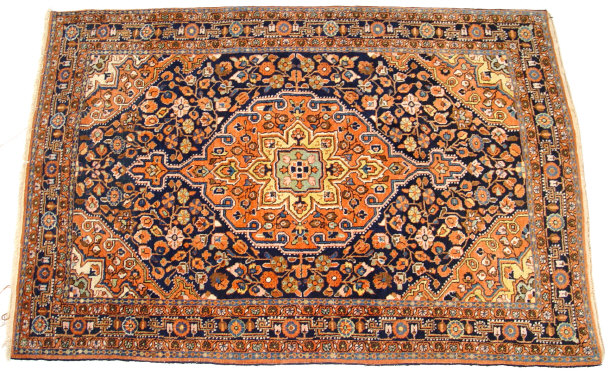 Appraisal: Rectangular orange and blue ground rug decorated with a geometric