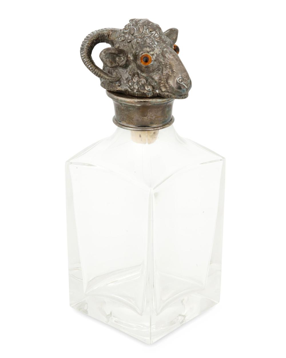 Appraisal: A GLASS AND SILVER-PLATE RAM'S HEAD DECANTERA glass and silver-plate