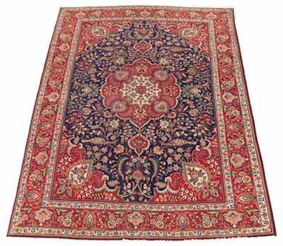 Appraisal: A Tabriz Carpet Red central medallion in dark blue cartouche