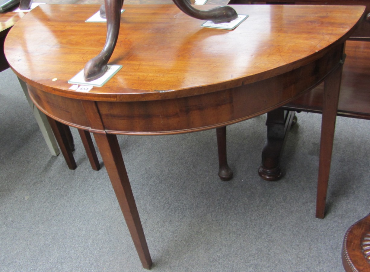 Appraisal: A George III mahogany semi elliptic side table on tapering