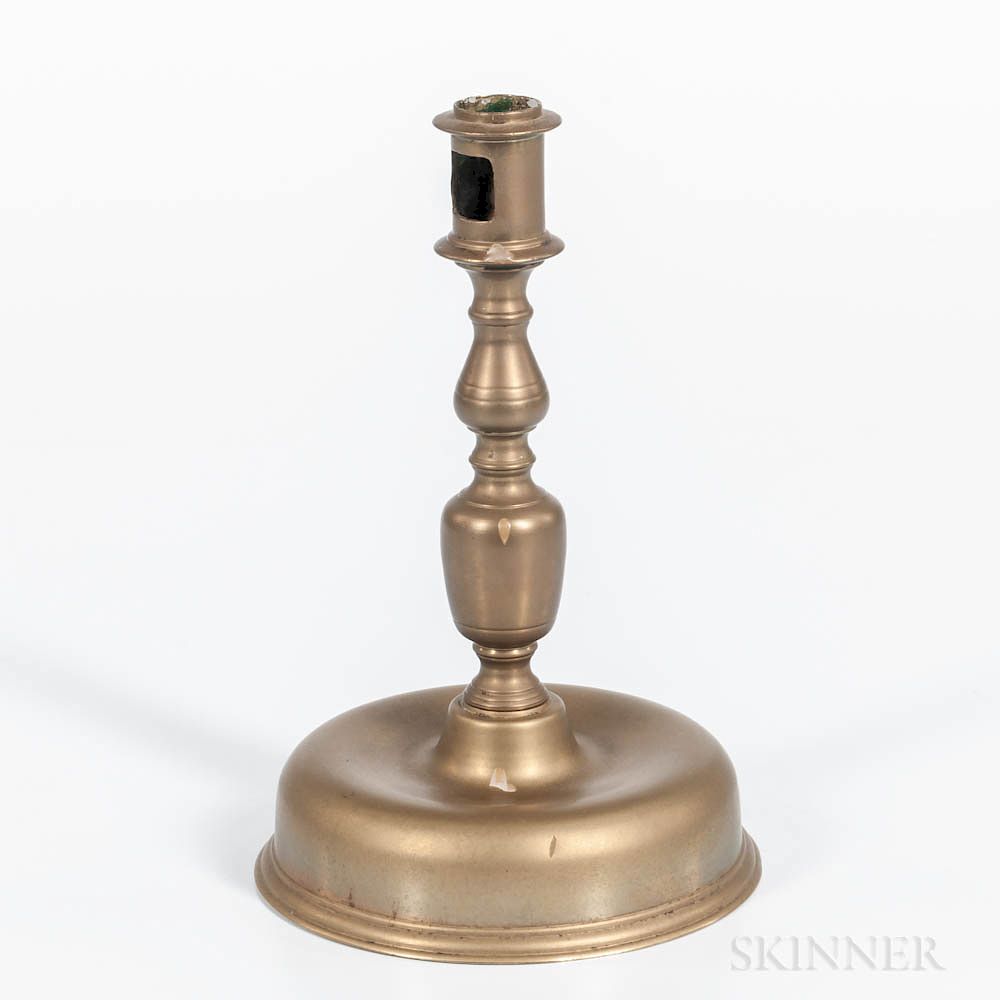 Appraisal: Early Brass Bun-base Candlestick Early Brass Bun-base Candlestick Europe mid-