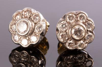 Appraisal: A pair of diamond cluster ear studs each nine-stone cluster