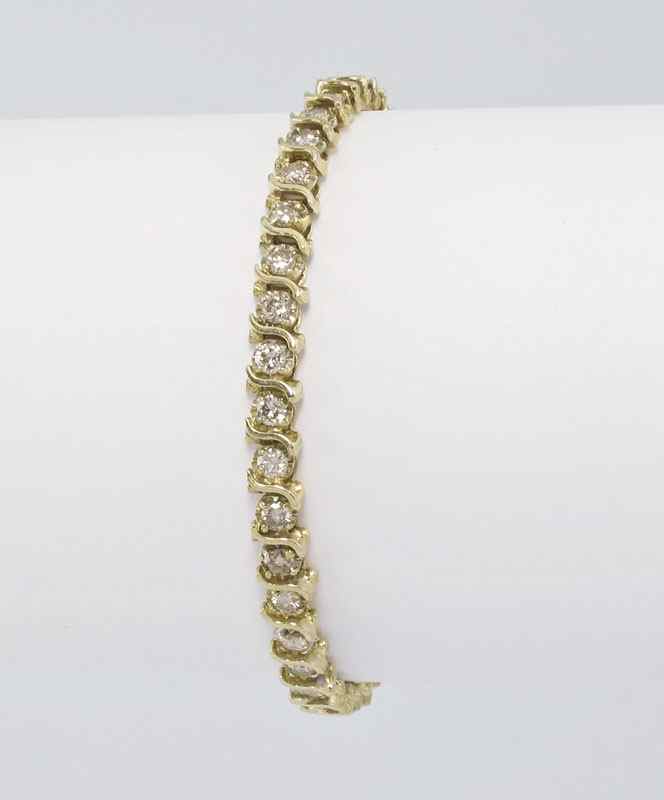 Appraisal: CT DIAMOND TENNIS LINE BRACELET K yellow gold bracelet contains