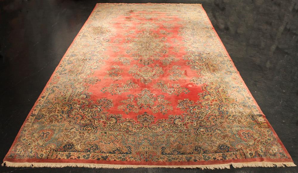 Appraisal: LARGE KERMAN WOOL RUG rose field filled with floral sprays