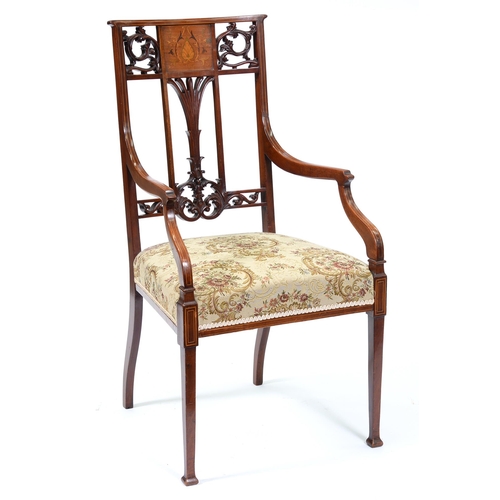 Appraisal: An Edwardian mahogany and inlaid armchair with carved and pierced